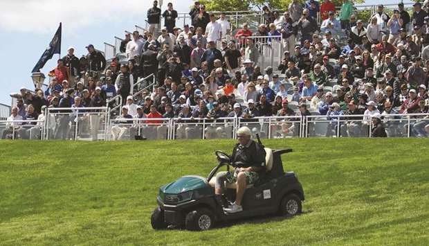 John Daly of the United States drives his golf cart down the first fairway during a practice round prior to the 2019 PGA Championship at the Bethpage Black course in Farmingdale, New York. (Getty Images/AFP)