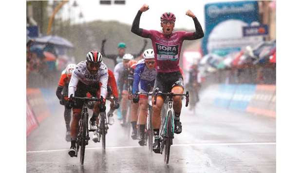 Team Bora rider Germanyu2019s Pascal Ackermann (right) celebrates as he finishes first ahead of Colombiau2019s Fernando Gaviria in stage five of the 102nd Giro du2019Italia yesterday. (AFP)