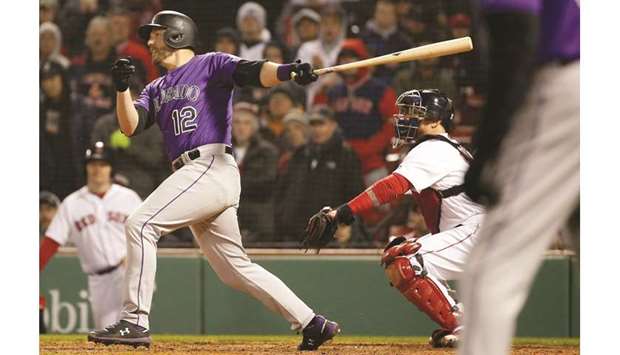 Colorado Rockies first baseman Mark Reynolds hits an RBI single during the eleventh inning against the Boston Red Sox at Fenway Park. PICTURE: USA TODAY Sports