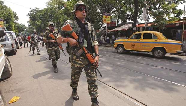Central Reserve Police Force (CRPF) personnel conduct route march in a street ahead of the seventh and last phase of general election, in Kolkata, yesterday.