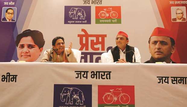 Bahujan Samaj Party (BSP) chief Mayawati speaks as Akhilesh Yadav, chief of Samajwadi Party (SP), looks on during a joint news conference in Lucknow.