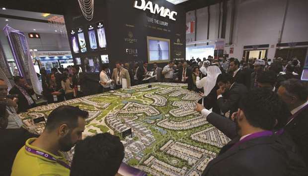 Visitors inspect Damacu2019s section at a Cityscape exhibition in Dubai (file). Analysts have warned the company is likely to continue facing challenges in the coming months with strong competition and the need to conserve cash for debt repayments.