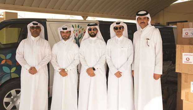 Vodafone Qatar and Hifz Al Naema officials.