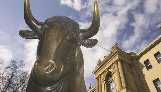 The bull statue outside the Frankfurt Stock Exchange. The DAX 30 ended 1.7% up at 12,310.37 points yesterday.