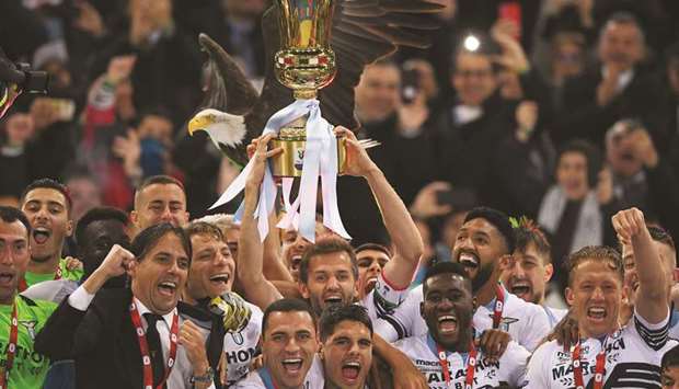 Lazio players celebrate with the trophy after winning the Coppa Italia on Wednesday.