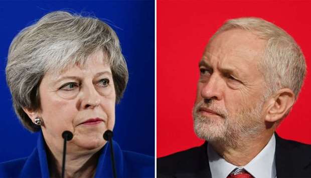 Britain's Prime Minister Theresa May (L)  and Britain's opposition Labour Party leader Jeremy Corbyn