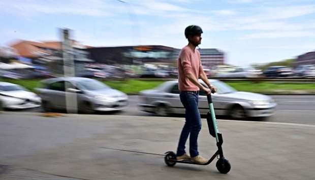 A man rides an E-Scooter  in Berlin