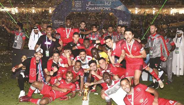 Al Duhail players and officials celebrate after their Amir Cup triumph at the Al Janoub Stadium on Thursday night. PICTURES: Noushad Thekkayil