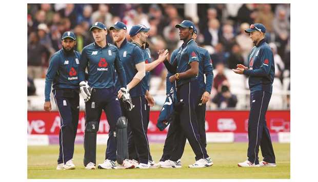Englandu2019s Jofra Archer (third from left) celebrates with teammates after taking the wicket of Pakistanu2019s Asif Ali during their fourth ODI in Nottingham yesterday.