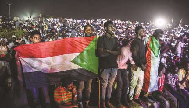 Sudanese protesters hold a sit-in outside the military headquarters in Khartoum late on Wednesday.