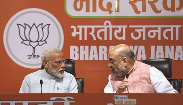 Prime Minister Narendra Modi and Bharatiya Janata Party president Amit Shah take part in a press conference in New Delhi yesterday.