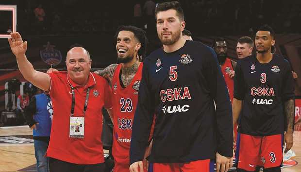 CSKA Moscow players and officials celebrate their EuroLeague semi-final victory over Real Madrid at the Fernando Buesa Arena in Vitoria. (AFP)