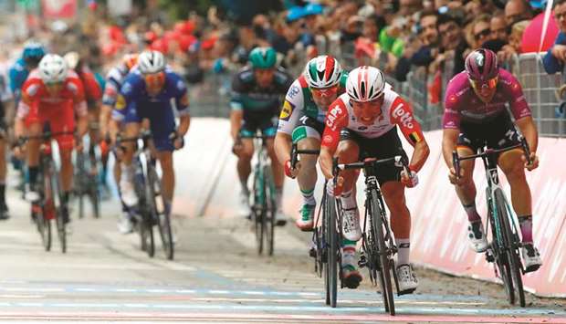 Team Lotto rider Australiau2019s Caleb Ewan (second) sprints to victory in the eighth stage of the 102nd Giro du2019Italia cycling race, 239km from Tortoreto Lido to Pesaro. (AFP)