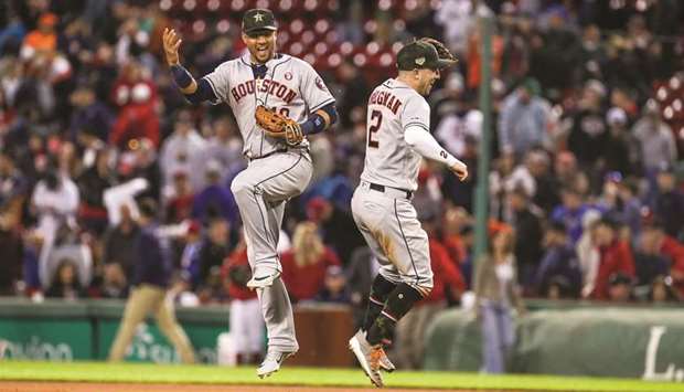 Houston Astros first baseman Yuli Gurriel (left) and third baseman Alex Bregman celebrate after defeating the Boston Red Sox at Fenway Park. PICTURE: USA TODAY Sports