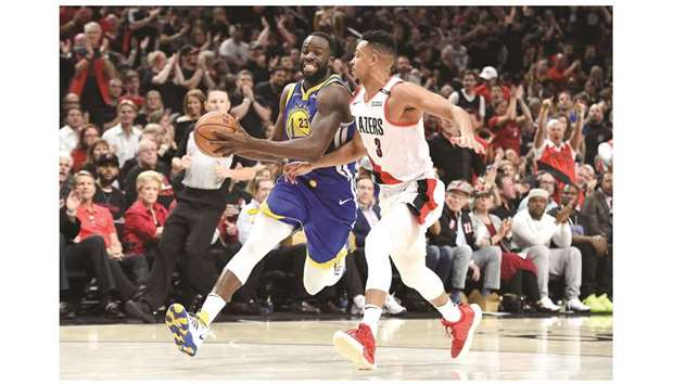 Draymond Green of the Golden State Warriors drives to the basket against CJ McCollum of the Portland Trail Blazers in game three of the NBA Western Conference Finals at Moda Center in Portland, Oregon. (Getty Images/AFP)