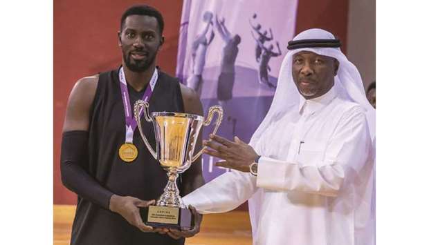 Abdullah Aman al-Khater presenting a trophy to a winner. At bottom winning players pose with their cheque.