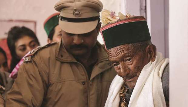 Shyam Saran Negi, 102, independent Indiau2019s first voter who has participated in all elections since 1951, leaves after casting his vote in Kalpa, Himachal Pradesh, yesterday.