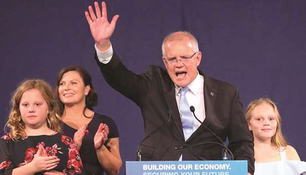 Australiau2019s Prime Minister Scott Morrison waves with his wife Jenny and daughters after winning during the Liberal-National coalition party election night event in Sydney on Saturday.