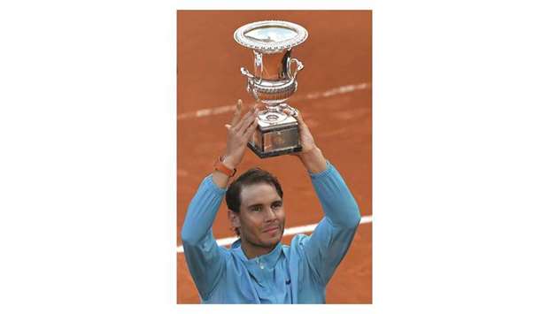 Rafael Nadal of Spain poses with the trophy after winning Italian Open at the Foro Italico in Rome yesterday. (AFP)