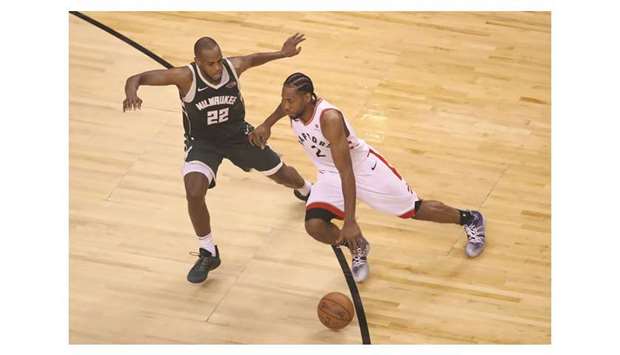 Toronto Raptors forward Kawhi Leonard dribbles the ball in the fourth quarter as Milwaukee Bucks forward Khris Middleton defends in game three of the Eastern conference finals of the 2019 NBA Playoffs at Scotiabank Arena. PICTURE: USA TODAY Sports