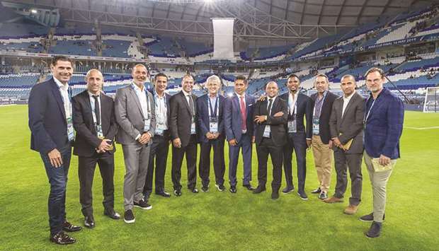 Former football stars pose at the Al Janoub stadium at its launch before the Amir Cup final last Thursday.