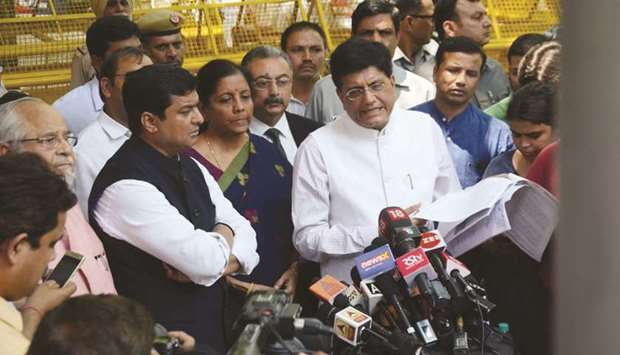 BJP leaders Piyush Goyal and Nirmala Sitharaman speak to reporters after meeting Election Commission officials in New Delhi yesterday.