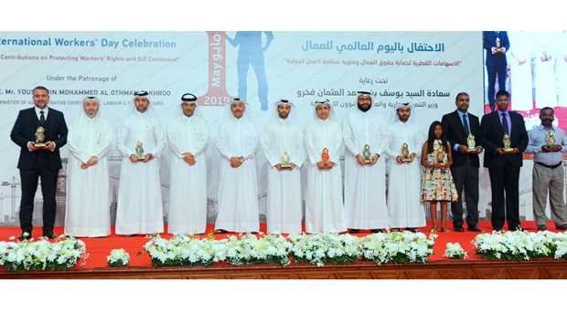 HE Yousuf bin Mohamed al-Othman Fakhro and other dignitaries with those honoured on the occasion. PICTURES: Ram Chand