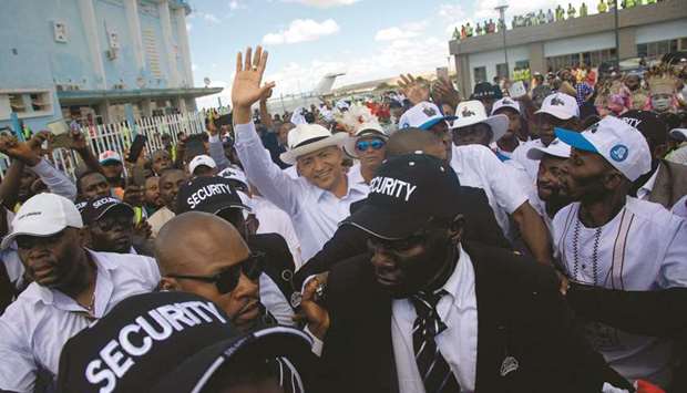 Democratic Republic of Congo opposition leader Moise Katumbi waves to supporters at Lubumbashi airport yesterday.