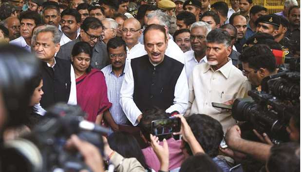 Opposition leaders talk to media representatives outside the Election Commission office in New Delhi yesterday.