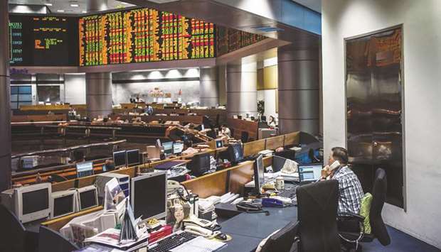 Traders and stock owners are seen on the floor of the RHB Investment Bank in Kuala Lumpur (file). Malaysiau2019s stock market and currency are set for a rebound from their slump following the elections almost a year ago, said Nazir Razak, former chairman of Malaysiau2019s second-largest bank.
