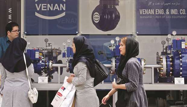 Visitors walk past a displayed gas equipment during the 24th International Oil, Gas, Refining & Petrochemical Exhibition at Tehran Permanent Fairground in Tehran yesterday. The US has terminated waivers allowing a handful of countries to buy Iranian crude in an effort to reduce Iranu2019s critical oil exports to zero.
