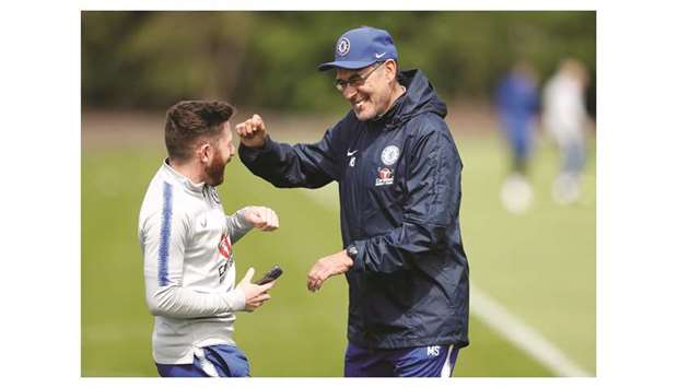 Chelsea manager Maurizio Sarri (right) talks to a player during a training session at the teamu2019s Training Centre in Cobham, England, yesterday. (Reuters)