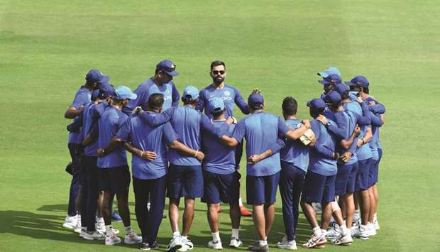 In this March 1, 2019, India cricket team captain Virat Kohli (centre) talks to his team members during a practice session ahead of the first ODI against Australia in Hyderabad, India. (AFP)