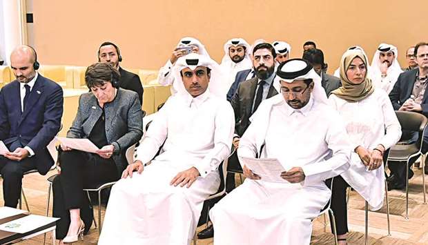 QU president Dr Hassan al-Derham and other officials at the event where the GWWI results were announced.