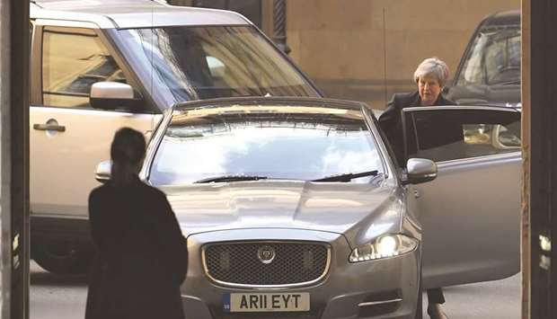 Prime Minister Theresa May leaves the Houses of Parliament in London, yesterday.