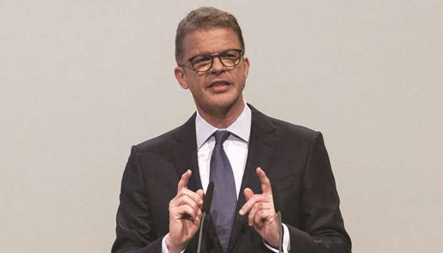 Deutsche Bank CEO Christian Sewing gestures while addressing the banku2019s annual general meeting in Frankfurt yesterday. u201cI can assure you: we are prepared to make tough cutbacksu201d to the securities unit, Sewing said.