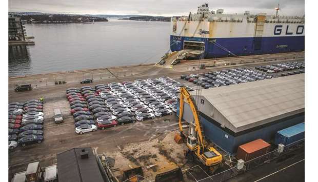 Automobiles produced by Tesla sit dockside after arriving on the Glovis Courageu00a0vehicles carrier vessel at the Port of Oslo. Tesla has struggled to build up operations to match sales in Norway, which leads the world in electric vehicles per inhabitant. As a result, customers have started to complain about bad service.