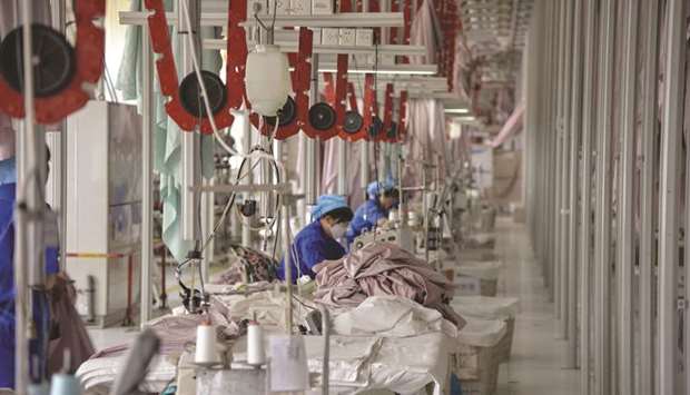 Chinese employees work on manufacturing products that will be exported to the US at a factory in Binzhou in Chinau2019s eastern Shandong province. China uses a series of five-year plans to organise its economic development and 2035 marks the year Beijing seeks to achieve u201csocialist modernisation,u201d when China will join the ranks of worldu2019s most innovative countries, according a blueprint laid out by President Xi Jinping in 2017.