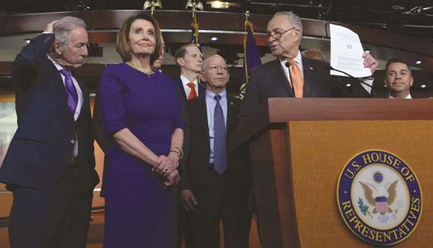 House Speaker Nancy Pelosi (D-CA), Senate Democratic Leader Chuck Schumer (D-NY) and other Democratic lawmakers speak to reporters after a planned White House meeting with President Donald Trump to discuss infrastructure was cut short yesterday.