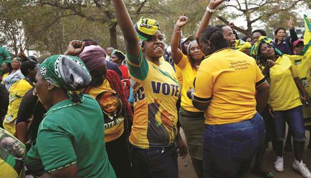 Supporters of former South Africa president Jacob Zuma sing outside the High Court in Pietermaritzburg yesterday.