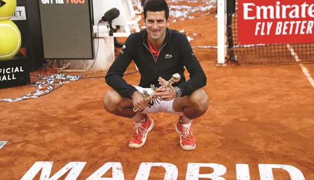 #Serbiau2019s Novak Djokovic celebrates with the Madrid Open trophy earlier this month. (Reuters)