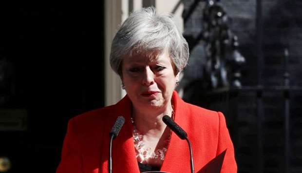 British Prime Minister Theresa May reacts as she delivers a statement in London, Britain