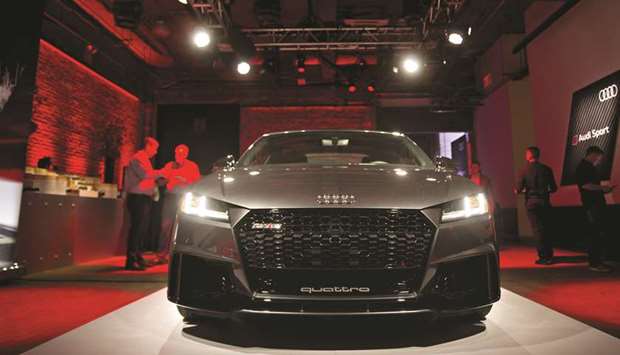 An Audi AG TT RS coupe vehicle sits on display during an event ahead of the international auto show in New York on April 11, 2017. Audi has been making the two-door TT since 1998. At the time, the modelu2019s sloping roof and sleek design signalled a shift away from its reputation for staid sedans. Audi will replace the TT with a new electric car u201cin a few years,u201d it said.