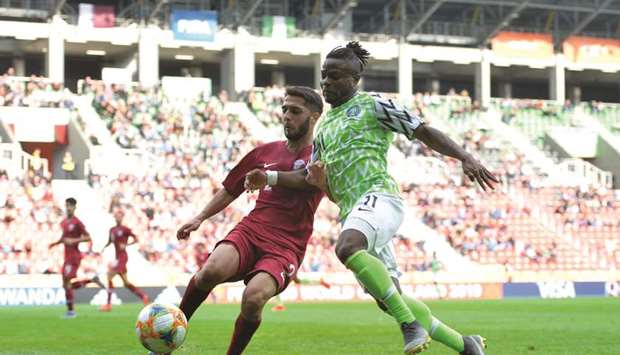 Qataru2019s Nasir Peer (left) battles for possession with Okechukwu Offia of Nigeria during the FIFA U-20 World Cup group D match at Tychy Stadium in Poland. (FIFA)