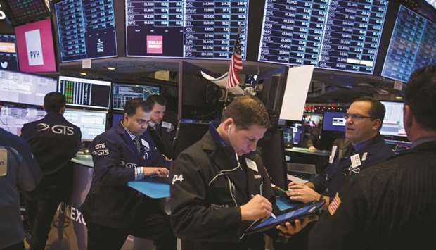 Traders work on the floor of the New York Stock Exchange (file). The worsening trade war is driving the steepest sell-off in Chinese shares traded in the US since the global financial crisis.
