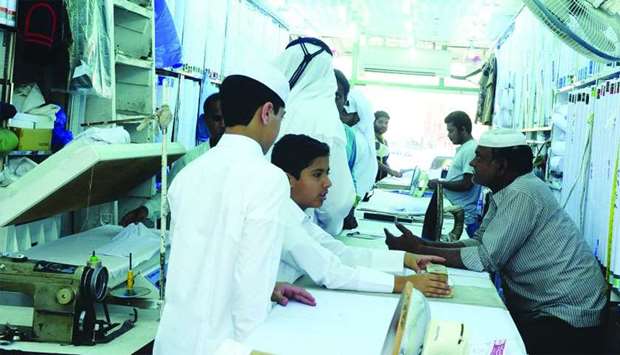 The rush at a textile-cum-tailoring shop in Doha. PICTURE: Shemeer Rasheedrnrn