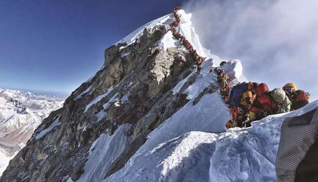 This photo taken on May 22, shows heavy traffic of mountain climbers lining up to stand at the summit of Mount Everest.