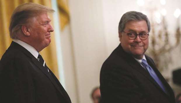 Trump with Barr prior to presenting the Public Safety Medals of Valour to officers in the East Room of the White House in Washington on Wednesday.