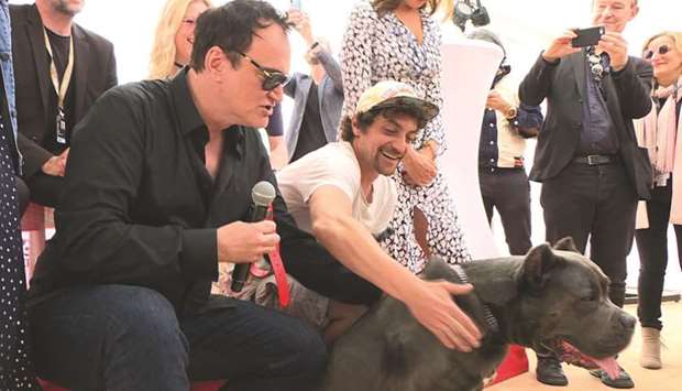 Tarantino with stand-in hound Haru as he attends the Palm Dog ceremony on the sidelines of the 72nd edition of the Cannes Film Festival.