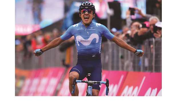 Team Movistaru2019s Ecuadorian rider Richard Carapaz celebrates his victory as he crosses the finish line to win stage 14 of the 102nd Giro du2019Italia in Courmayeur, Italy, yesterday. (AFP)